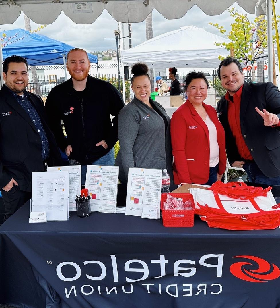 Ashland - Patelco team smiling behind the Patelco booth